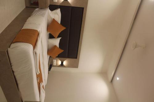 a bedroom with a bed in a small room at Hotel Metro Inn in Mumbai