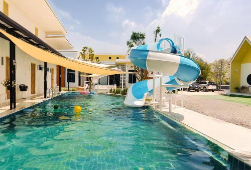 a pool with a water slide in a house at 189Premier Villa Lamphun in Lamphun