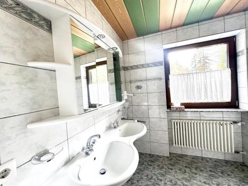 a bathroom with a sink and a mirror at Chalet Josi in Leutasch
