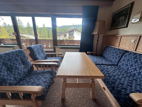 a living room with a couch and a table at Chalet Josi in Leutasch
