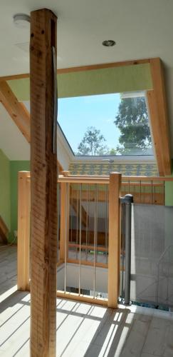 a view from the inside of a house with a balcony at Ferienhaus Katharina - Urlaub Unter den Klippen in Lügde