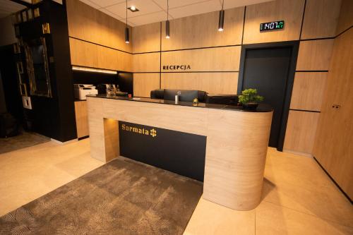 a lobby with a reception counter in a building at Sarmata in Czyżówek