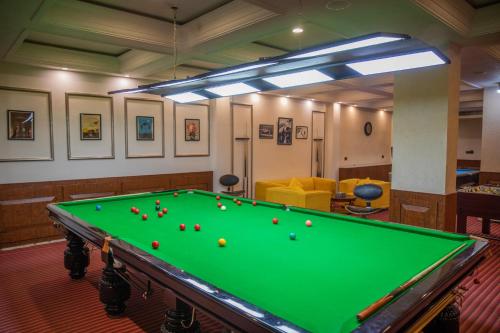 a pool table in a room with balls on it at The Abduz in Leh