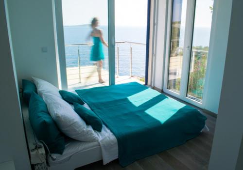 Ένα ή περισσότερα κρεβάτια σε δωμάτιο στο VillaBlu.EU