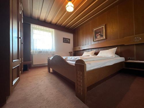 a bedroom with a large bed in a room at Chalet Josi in Leutasch