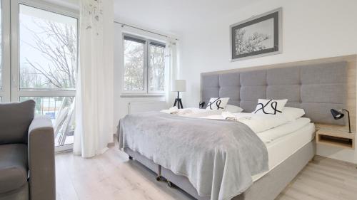 Ένα ή περισσότερα κρεβάτια σε δωμάτιο στο Mare Promenada, Sun & Snow