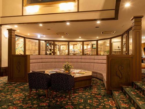 a dining room with a table and chairs at Sasara in Gero