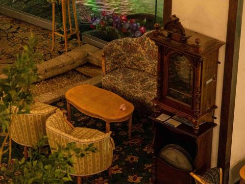 a living room with a couch and a table at Sasara in Gero