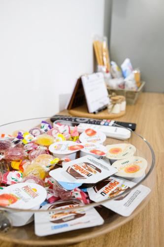 a glass table with a bunch of food on it at Home Sweet Home da Viky in Bari