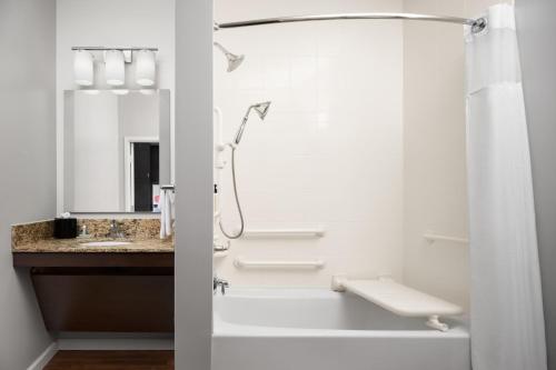 a bathroom with a shower and a sink at TownePlace Suites by Marriott Champaign in Champaign