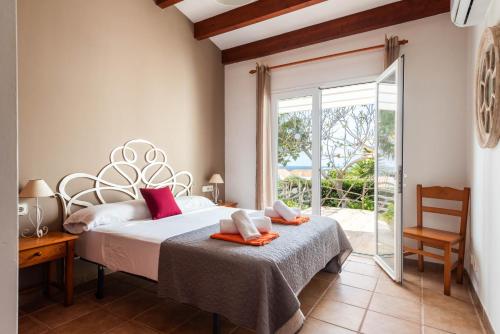 Ένα ή περισσότερα κρεβάτια σε δωμάτιο στο Villa Los Remos