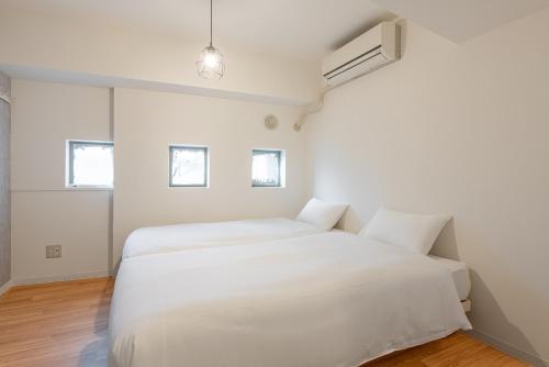 Voodi või voodid majutusasutuse 東新宿 1008 toas