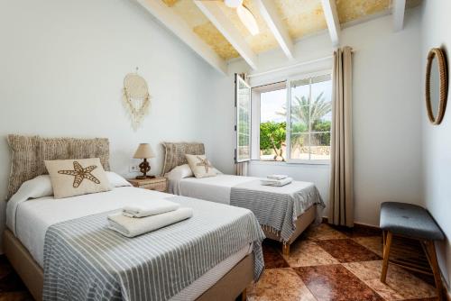 Ένα ή περισσότερα κρεβάτια σε δωμάτιο στο Villa Sa Moreneta
