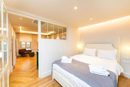 a bedroom with a large bed with towels on it at Liberty Residence in Istanbul
