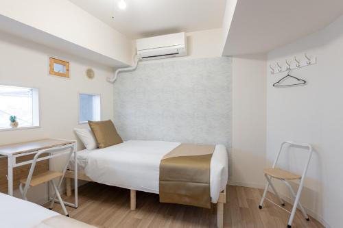 Ένα ή περισσότερα κρεβάτια σε δωμάτιο στο 東新宿 1108