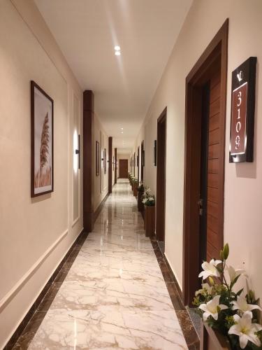 a corridor of a hotel with a long hallway at XU San Stefano Hotel Alexandria in Alexandria