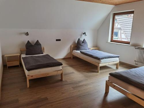 Postel nebo postele na pokoji v ubytování Main Appartement-Haus - 97896 Freudenberg