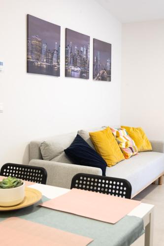 a living room with a couch and a table at CDP Apartman 5 in Alsóörs