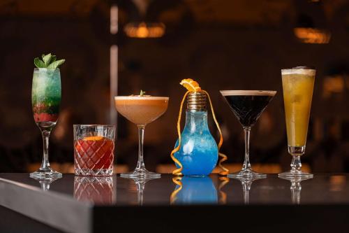 a group of different types of drinks on a table at Radisson Blu Manchester Airport in Hale