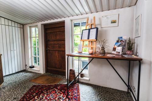 a room with a table and a door at Gasthaus Fiester Hannes in Burbach