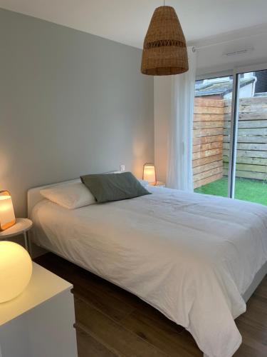 En eller flere senge i et værelse på Petite maison cosy