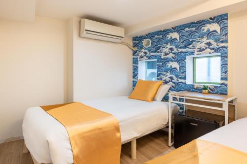 Ένα ή περισσότερα κρεβάτια σε δωμάτιο στο 東新宿1103