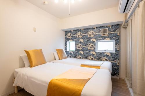 Ένα ή περισσότερα κρεβάτια σε δωμάτιο στο 東新宿 1102