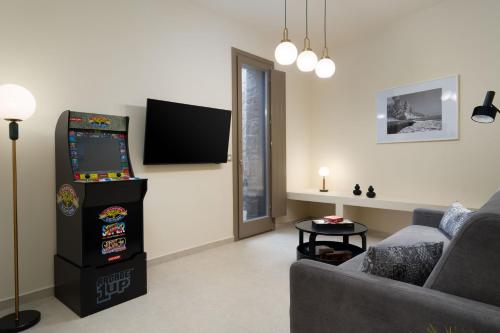 a living room with a video game at Bay View Residences Santorini in Akrotiri