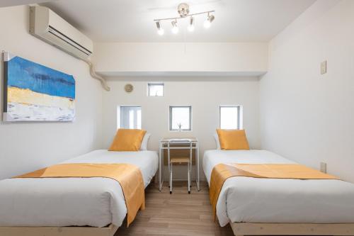 Ένα ή περισσότερα κρεβάτια σε δωμάτιο στο 東新宿 1101