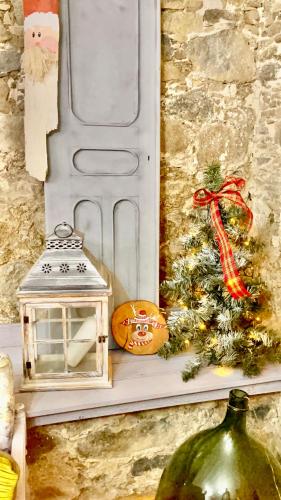 a christmas decoration with a christmas tree and a lantern at Holiday House Prodromos in Prodromos