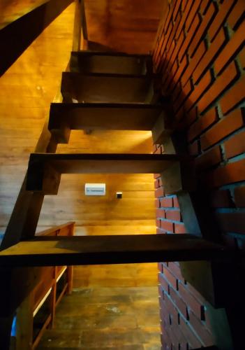 a set of stairs with a brick wall at Syara villa in Unawatuna