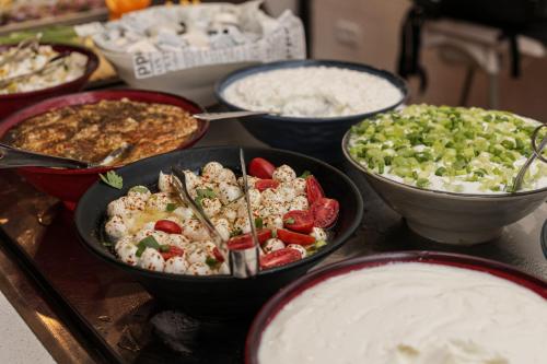 a group of bowls of food on a table at G hotel in Eilat