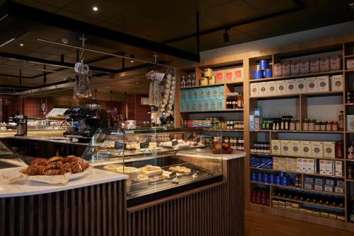 a bakery with a lot of food on display at Sky Hotel Apartments, Stockholm in Stockholm