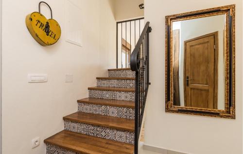 a mirror on the wall next to a stairway at Awesome Home In Gospic With Wifi in Gospić