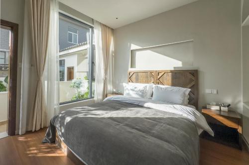Postel nebo postele na pokoji v ubytování Shan Di B&B