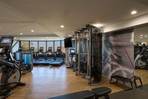 a gym with treadmills and machines in a room at Phoenix Marriott Resort Tempe at The Buttes in Tempe