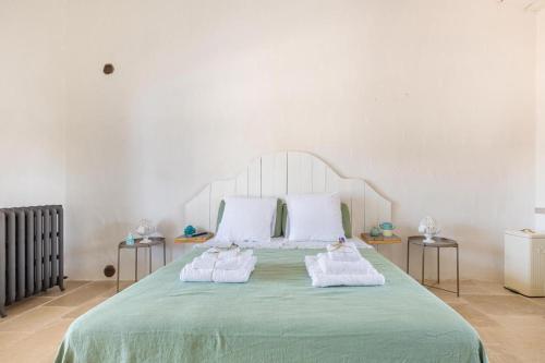 Ένα ή περισσότερα κρεβάτια σε δωμάτιο στο Masseria Santella