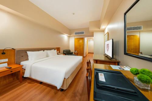 Ένα ή περισσότερα κρεβάτια σε δωμάτιο στο Saigon Prince Hotel