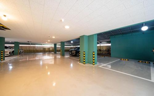 an empty parking garage with cars parked in it at Rosy Hotel in Cheongju
