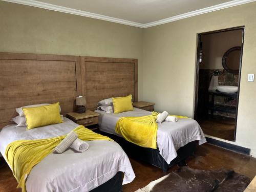 Katil atau katil-katil dalam bilik di Humdani Game Lodge