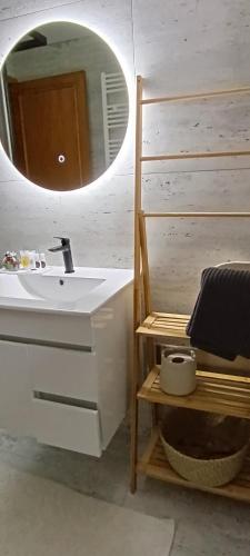 a bathroom with a sink and a mirror at Golden Mountain, Nature House in Manteigas