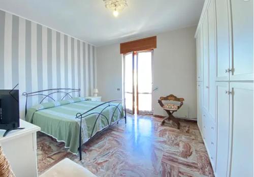 a bedroom with a bed and a television in it at MR1 House Gallipoli in Gallipoli