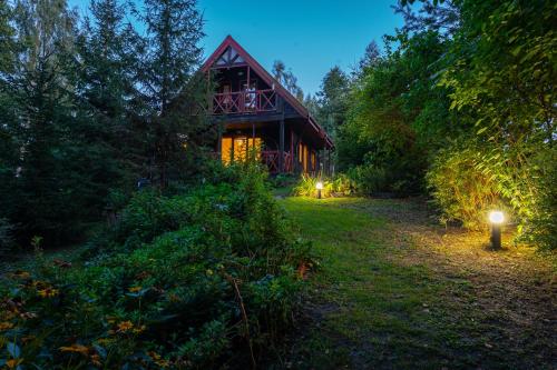 Vonkajšia záhrada v ubytovaní Garden House nad jeziorem Szelment