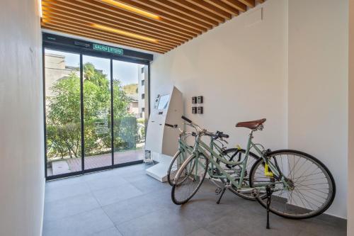 a bike parked in a room with a wall at Uma Suites Ondarreta in Donostia-San Sebastián