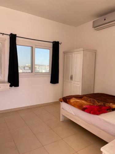 Una cama o camas en una habitación de Elite Residence Dahab