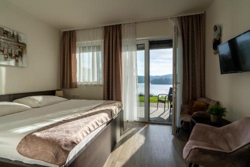 Postel nebo postele na pokoji v ubytování Rezidence Sunny Hill