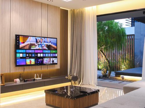 Μια τηλεόραση ή/και κέντρο ψυχαγωγίας στο 花石间精品民宿 - Exquisite EcoVille by Cowidea