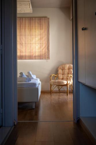 Postel nebo postele na pokoji v ubytování Triantafillas Suites