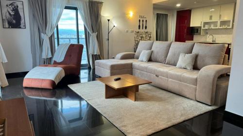 a living room with a couch and a coffee table at Rocha Tower 13D - Skyline Ocean View in Portimão