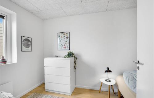 a bedroom with white walls and a white dresser at Stunning Apartment In Thisted With Wifi in Thisted
